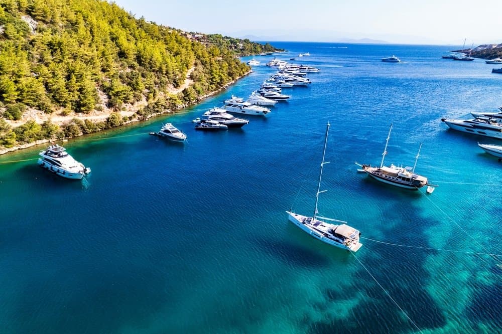Luxury yachts anchored in a secluded turquoise bay along the Turkish Riviera