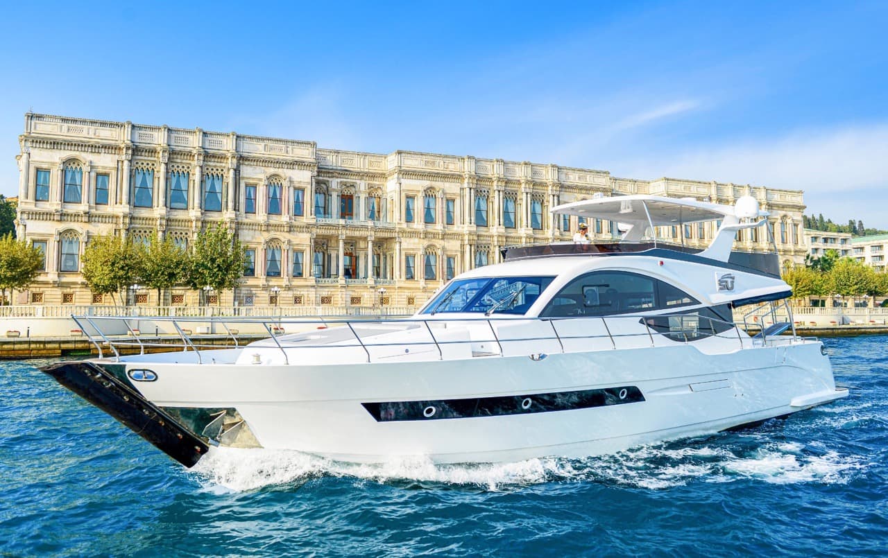 A luxury yacht cruising along the Bosphorus, offering stunning views of Istanbul's skyline.